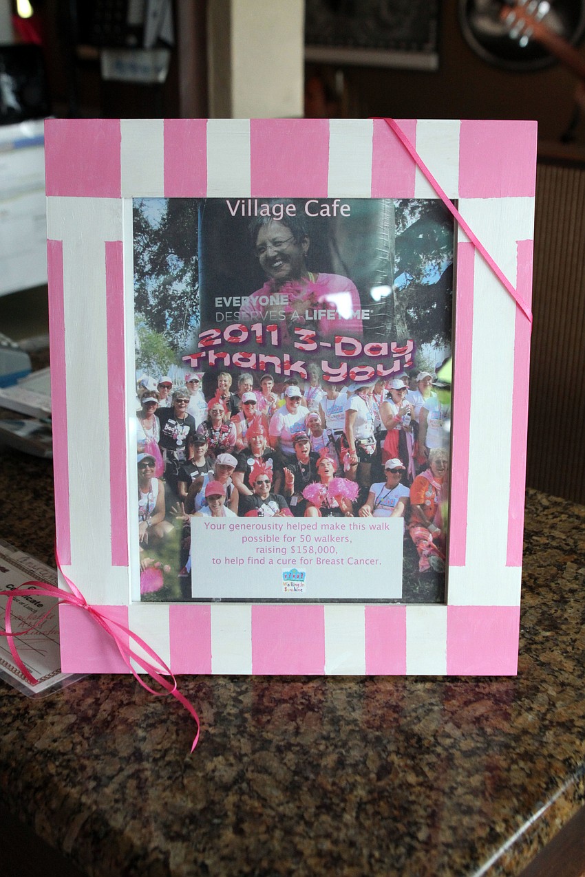 The Kouvatsosâ€™ received a framed gift for hosting the Drink Pink fundraiser on Saturday.