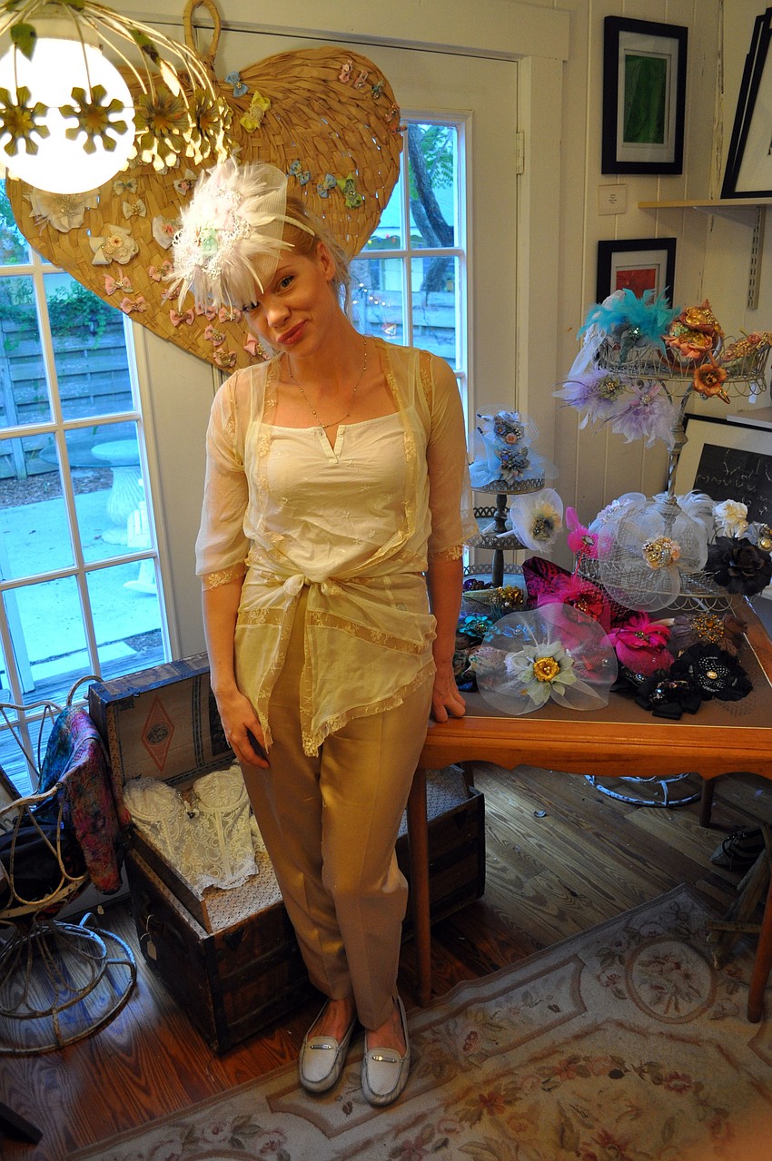 Daniella Landelius shows off one of her decorative hats.