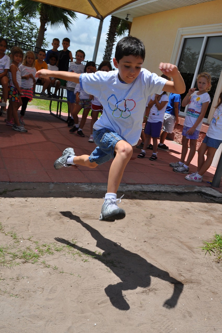 Cayden Kozma, 8, tested his skills at the long jump.