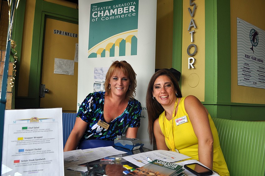 Jamie Overmiller and Tori Artusa checked people into the SCC Power Hour Lunch, Wednesday, Aug. 22, at the Daiquiri Deck on St. Armands.