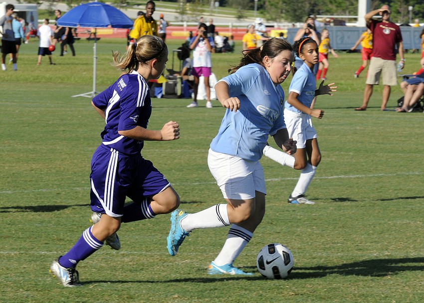 Amanda Waskiewicz, 11, breaks past an Orlando City Soccer opponent and heads toward the goal.