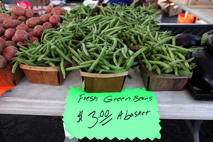 Overflowing baskets of green beans were for sale at the Yum Yum Tree produce tent Sunday, Sept. 1 at the Siesta Key Farmers Market.