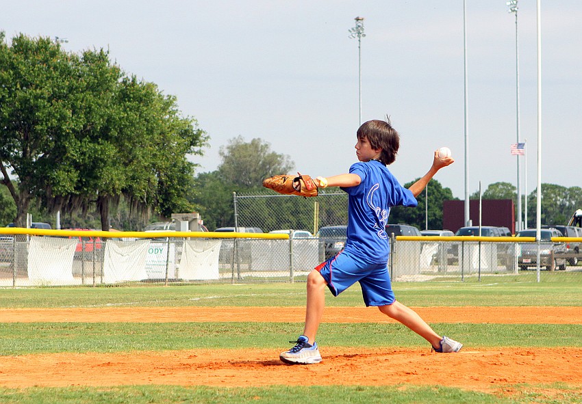 Michael Meisner, as Brooklyn Dodgers #25 Casey, gets ready to pitch the ball  Friday, April 29 during the Ashton Elementary fifth grade World Series day at Twin Lakes.