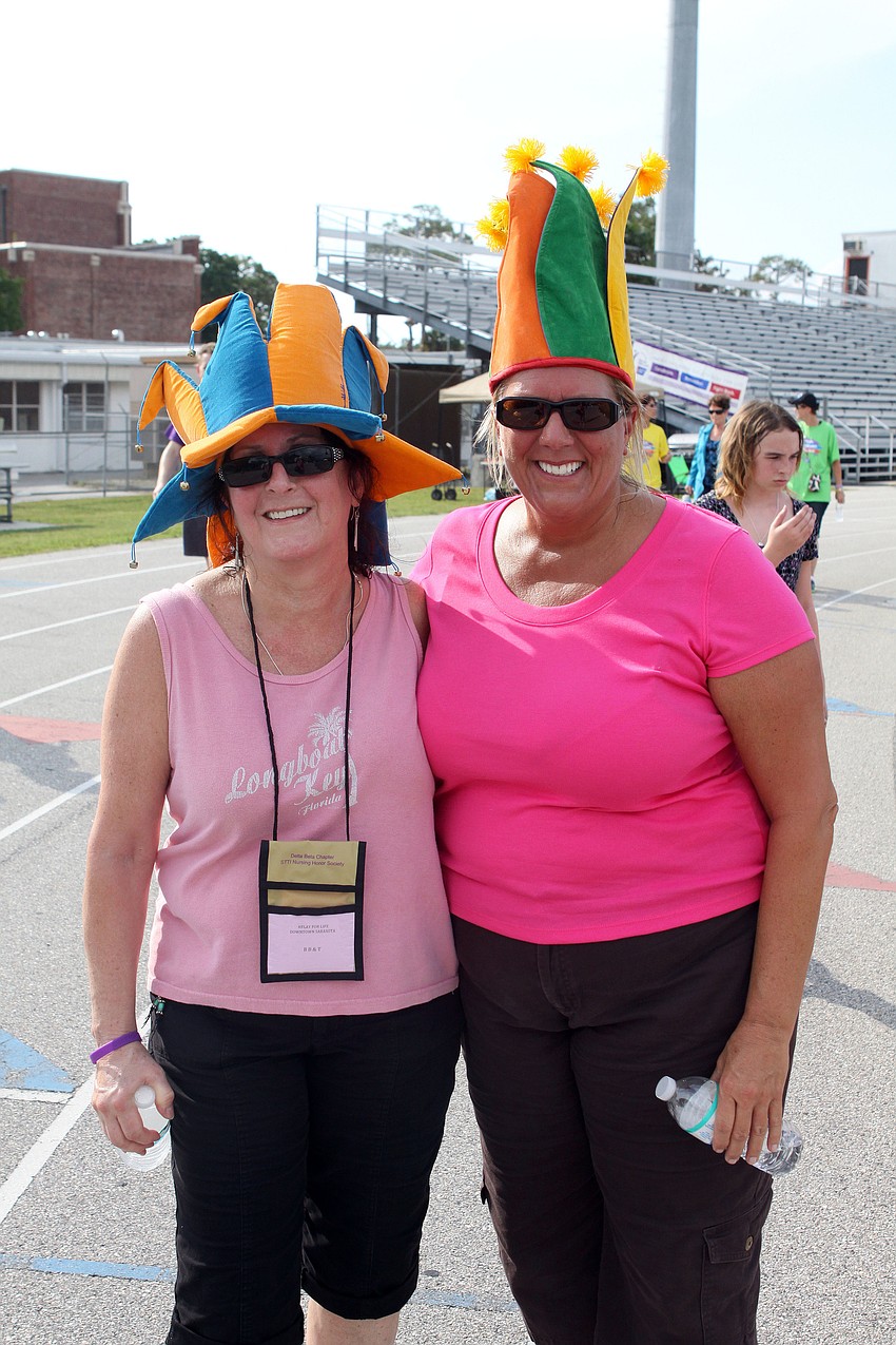 Nancy Jones and Lisa Bauer of BB&T during the â€œCrazy Hat Lapâ€.
