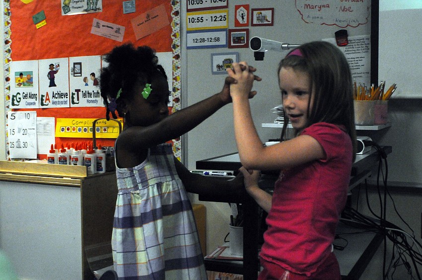 Six-year-olds Jamaria Carter and Alyssa Micallef were partners during their classâ€™ musical performances.