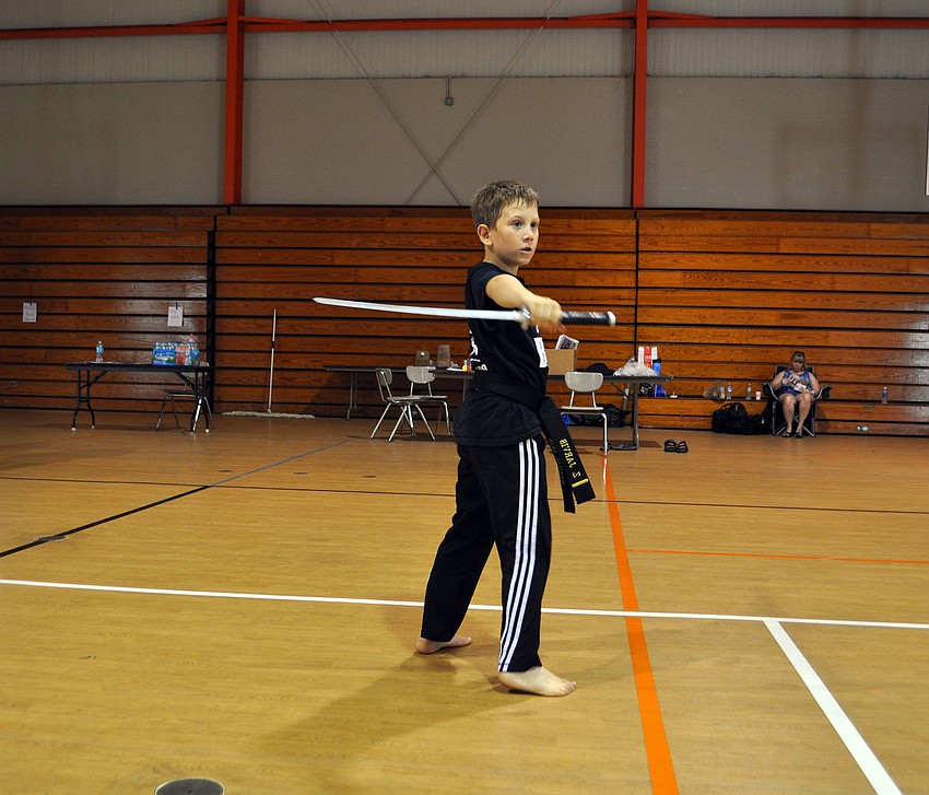 Zachary Jarvis practices his weapons kata with a sword.
