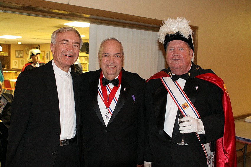 Father Bernard Evanofski, Thomas Anzelone and Jim Murphy