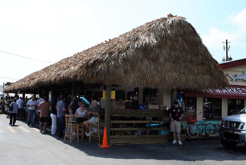The Chickee Hut at Waltâ€™s Fish Market had its grand opening, Sunday, May 27. All the food was free and the drink proceeds went towards the Tom Wallinâ€™s Reef fund.