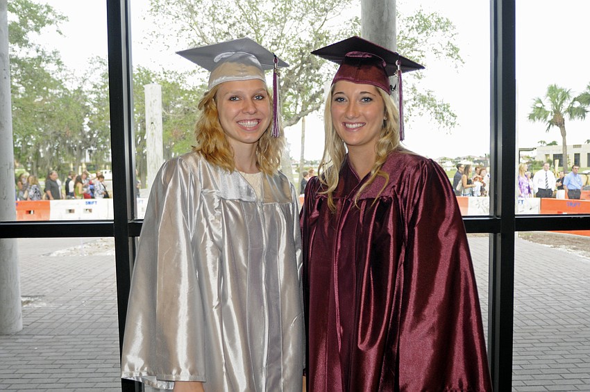 Emily Karg and Nicole Hubbard enjoyed people watching before the start of the commencement ceremony.