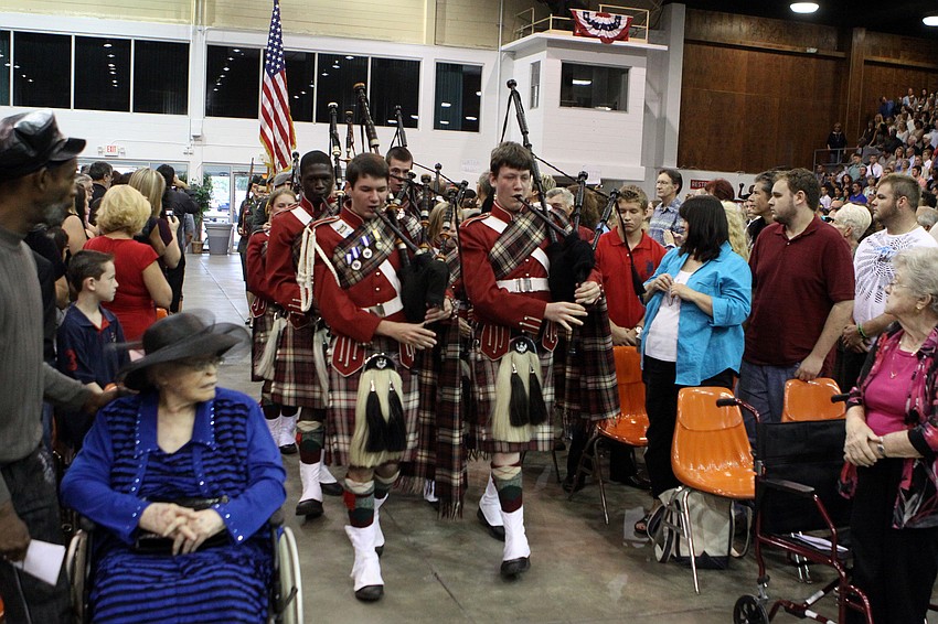 Pipers make their way down the aisle to begin the graduation ceremony for Riverview High School.