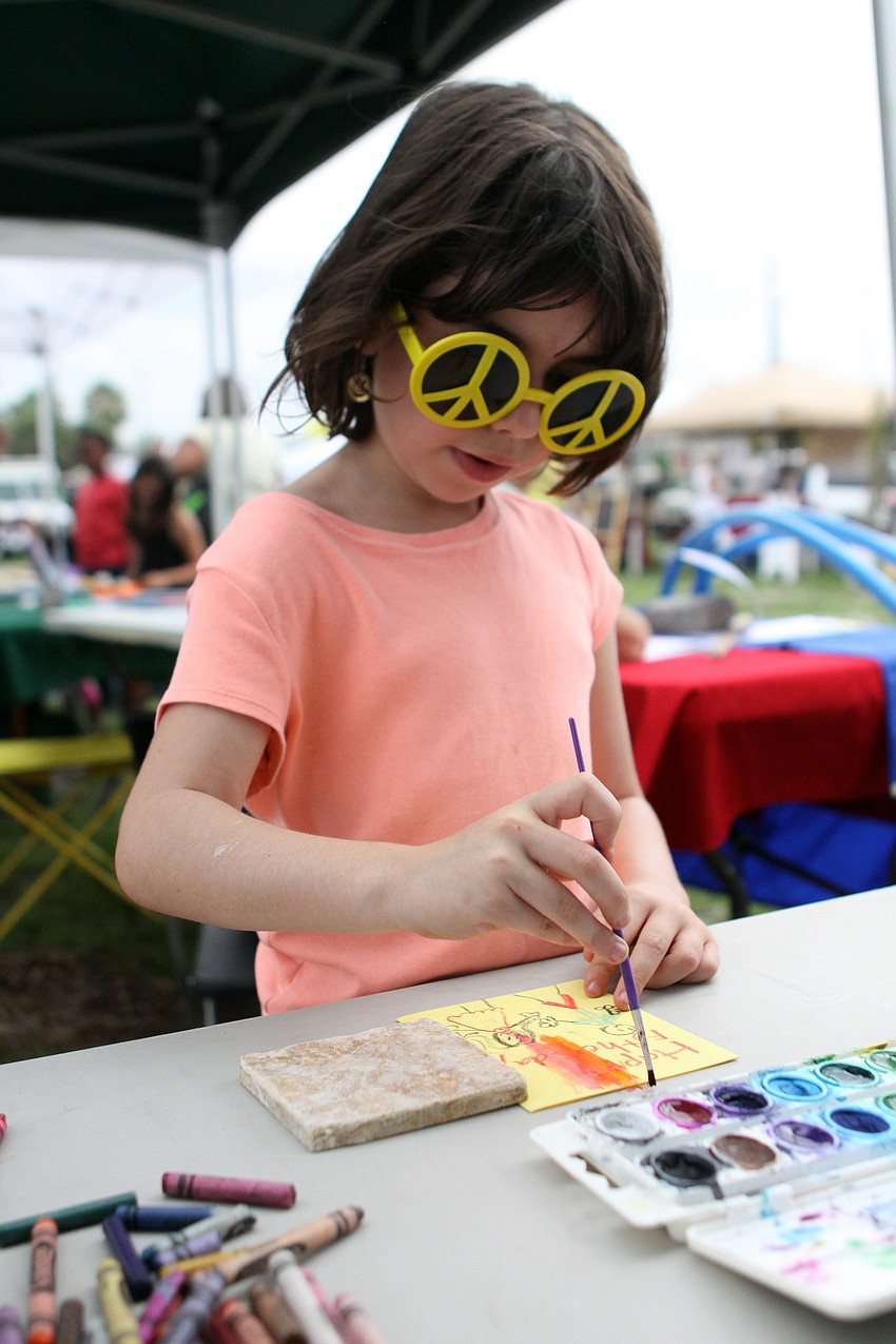 Lucy Eiseman, 6, has fun at the Arts Center Sarasota booth making a Fatherâ€™s Day card for her dad.