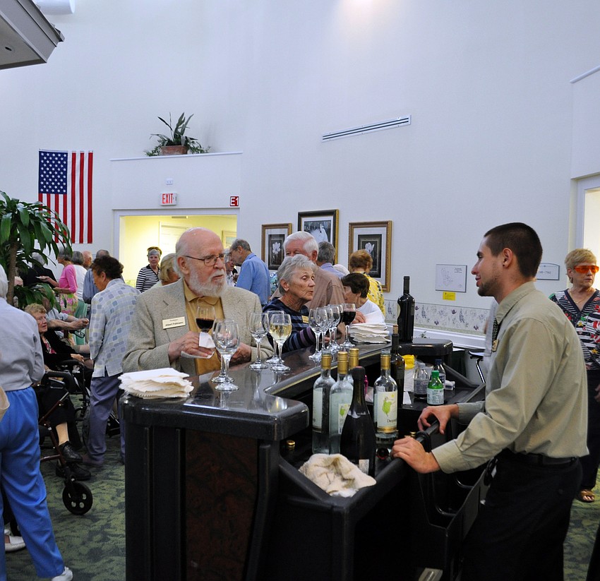Residents enjoyed wine and snacks during the Carroll Centerâ€™s grand reopening.