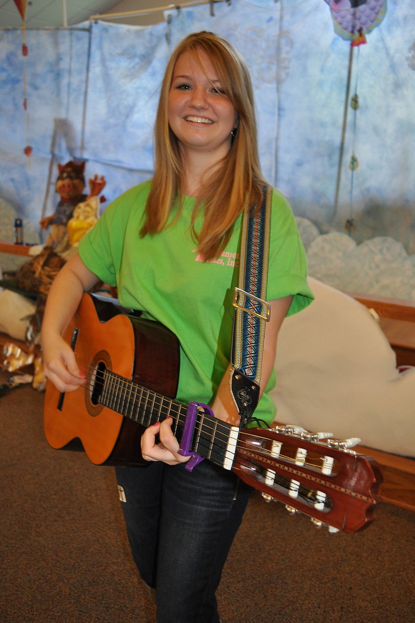 Caitlin Hermanson, 16, provided live music for the children.