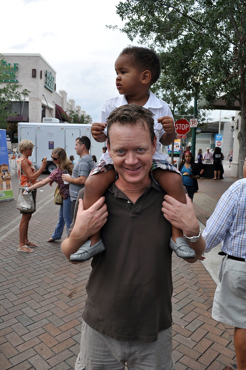 David Harlan gives Shaun Harlan-Vale a better view of the party.