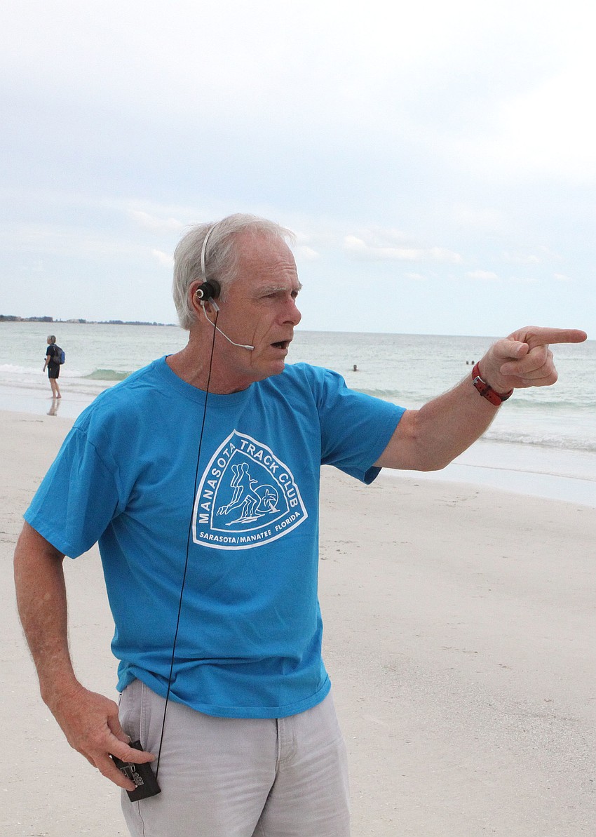 Dan Pollock tells the runners to line up for the race, Tuesday, June 19.