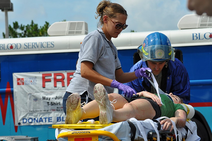 Emergency workers loaded up one of the victims.