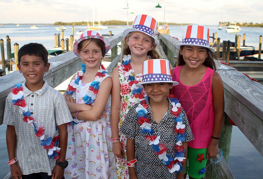 Dane Leonard, 9, Martha Baillie-Sharp, 7, Louisa Baillie-Sharp, 8, Caden Leonard, 7, and Sophia Leonard, 11, pose all together in their patriotic attire, Monday, July 2, on the Mar Vista dock.