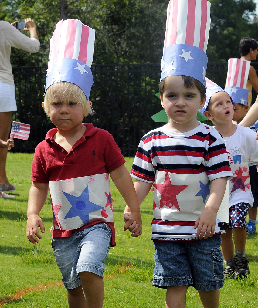 Three-year-olds Cameron Quartermaine and Parker Lui helped lead their class in celebration.