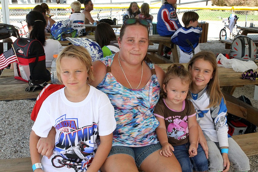 Trista Pugh with her children Brandon Raucci, 7, Allyson Raucci, 19 mos., and Jessica Raucci, 6, Saturday, July 7, during Olympic Day at Sarasota BMX.
