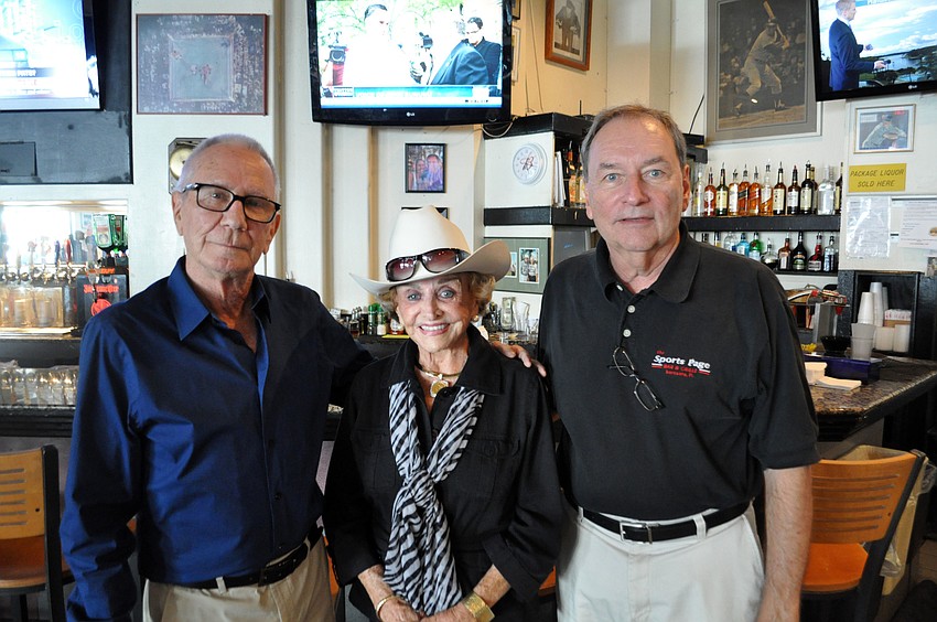 Ray Printz of Sports Page, Edith Barr Dunn and Bob Richards, owner of Sports Page