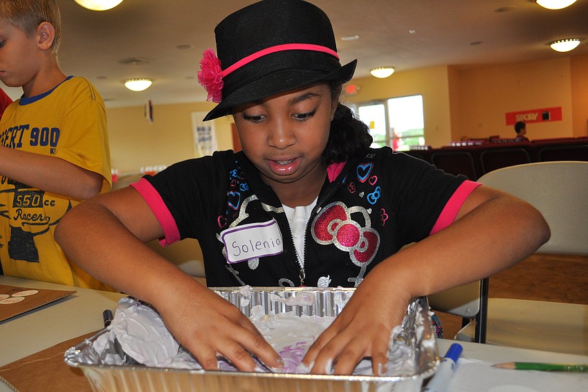 Solenia Caminero decorated a heart with paint and shaving cream.