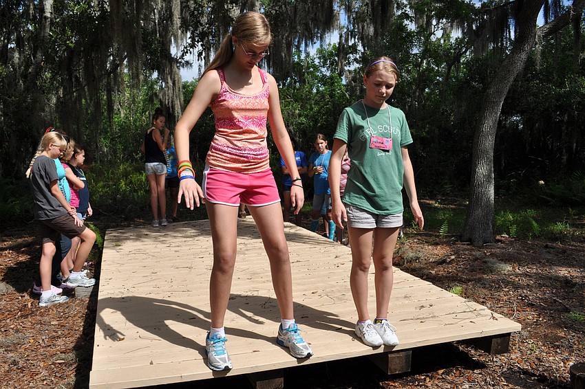 Cypress Potter and Alissa Shea balanced on the 