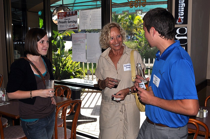 Victoria Lipetri, Claudette Giever and Micahel Lipetri chat amongst themselves during the SKCC After Hours,Thursday, Aug. 16, at the Village CafÃ©.