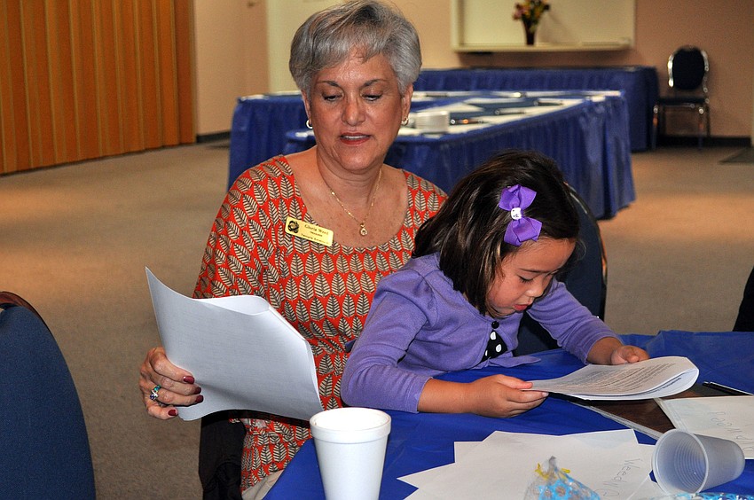 Gloria Weed and her granddaughter, Ava Weed, 5, sing along, Saturday, Aug. 18.