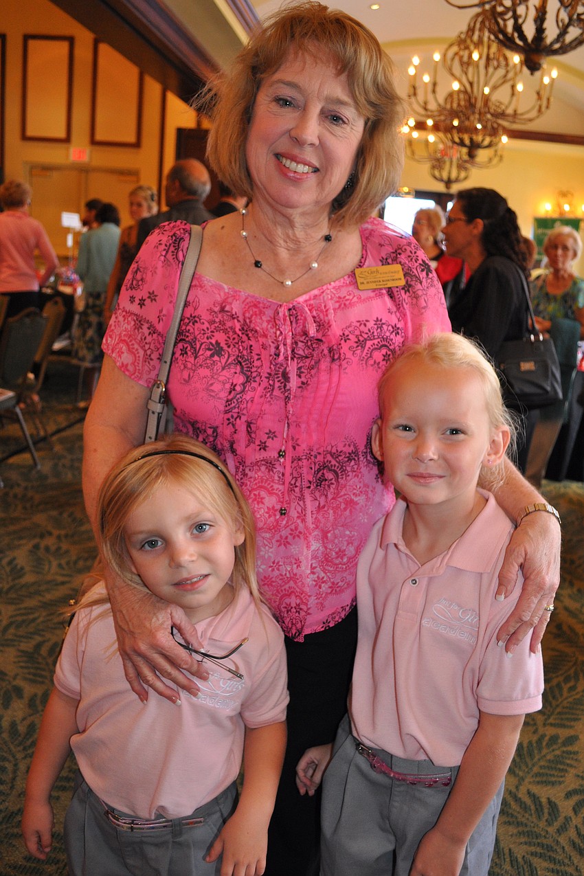 Just for Girls Academy Principal Jennifer Rosenboom is pictured with her granddaughter,  Madison Rosenboon, left, and student, Alana Weaver.