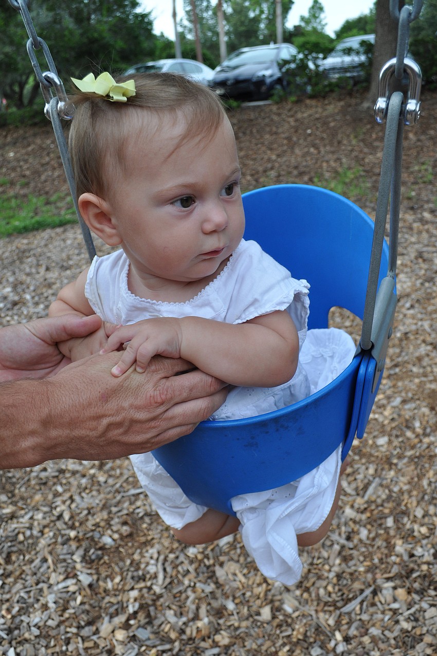 Estella Fairweather, 9 months, got a push from her dad, Colin, not pictured.