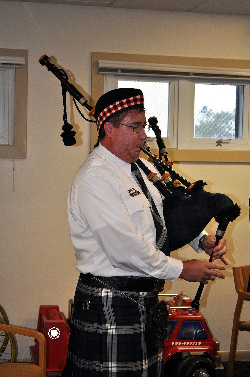 Firefighter Max Jones played â€œAmazing Graceâ€ on the bagpipe Tuesday, Sept. 11 during the ceremony held in the classroom at Station #2.