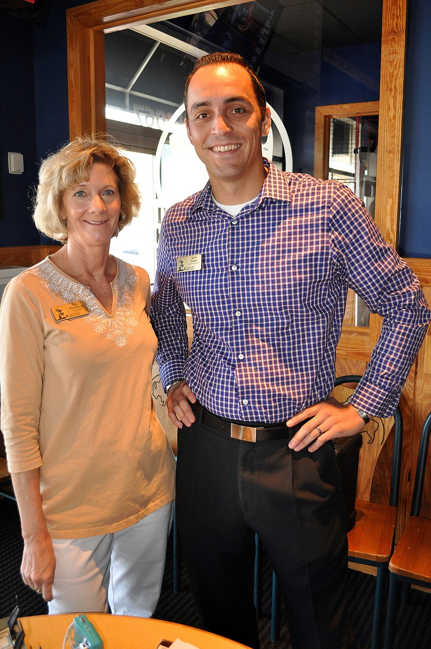 Tess Herschman and Kevin Cooper pose together during the Siesta Key Chamber luncheon Friday, Oct. 7 at Buffalo Wild Wings.