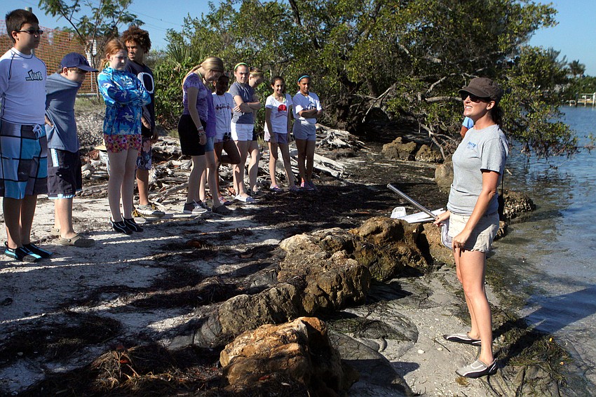 Dana Henderson talks to the 6th graders about being safe out in the water and how to use their nets for their research projects.