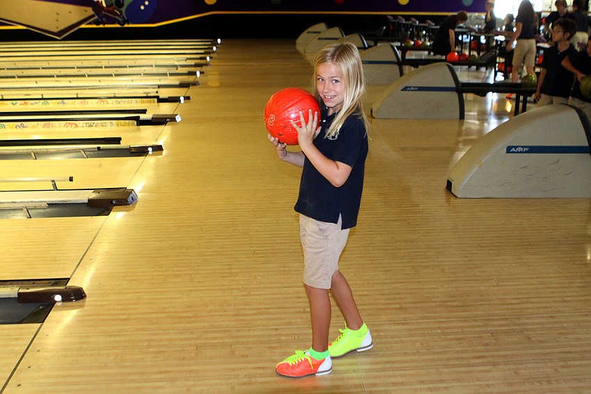 Aston Harris, 7, gets ready to bowl.