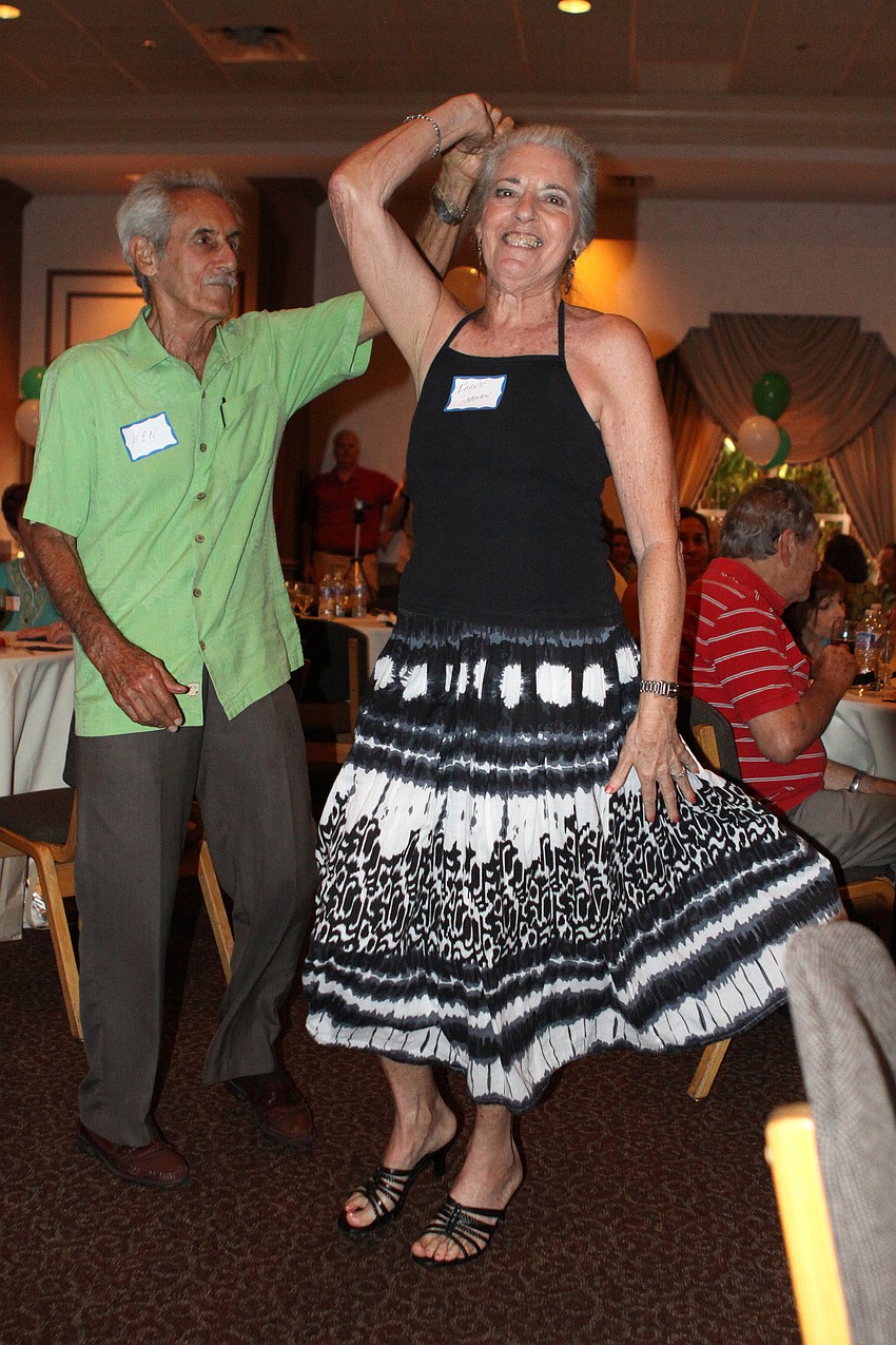 Ken Herman spins his wife, Irene, around while they dance to Jimi Geeâ€™s All Star Band.