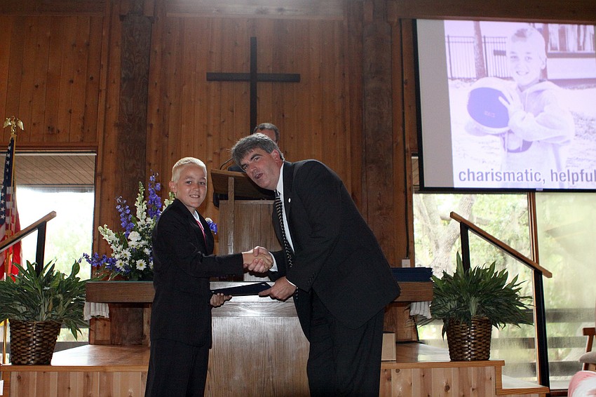 Taber Chadwick receives his diploma from Headmaster David Mahler, Friday, June 1, at Siesta Key Chapel.