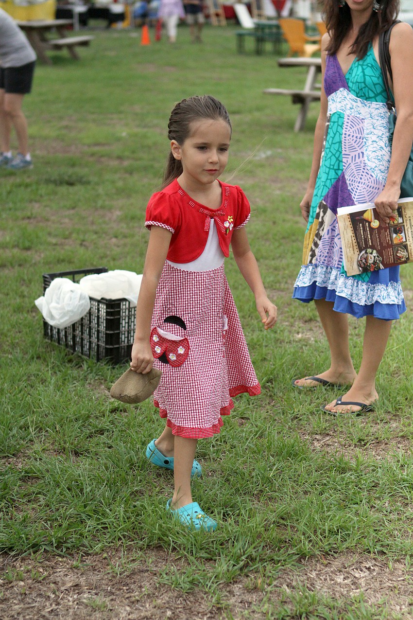 Shirley Fehr, 6, gets ready to throw a beanbag.