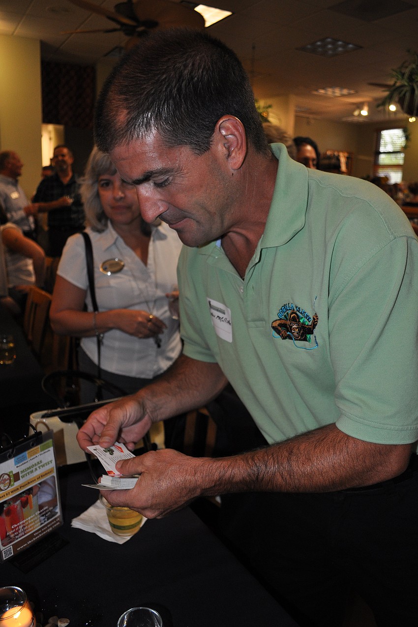 Steve McCallister, of Gorilla Kleen, passed out business cards.