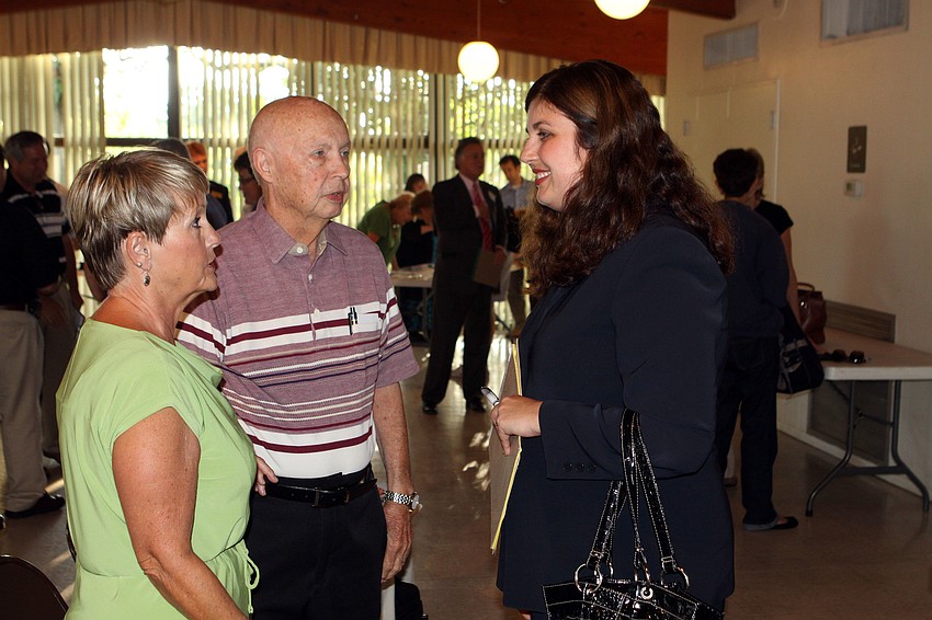 Commissioner Christine Robinson chats with Alisa and Parker Summerlin, Monday, June 11, prior to the beginning of the CONA meeting.