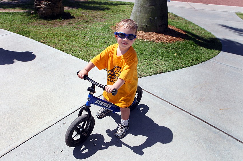 Caleb Elliot, 2 Â½, enjoyed riding a Strider bike and playing on the new playground, Saturday, June 16, during the Sarasota Sports Festival at Payne Park.