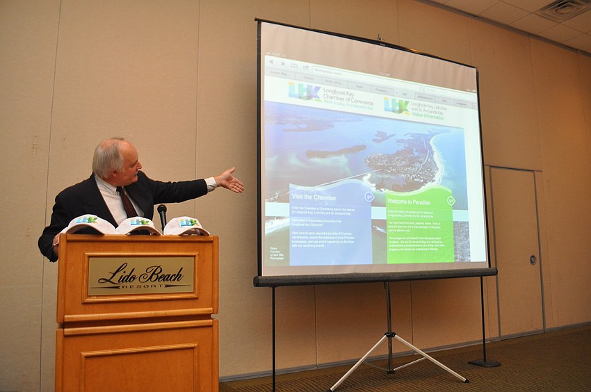 President of the Longboat Key, Lido Key, St. Armands Key Chamber Tom Aposporos shows off the new Chamber website