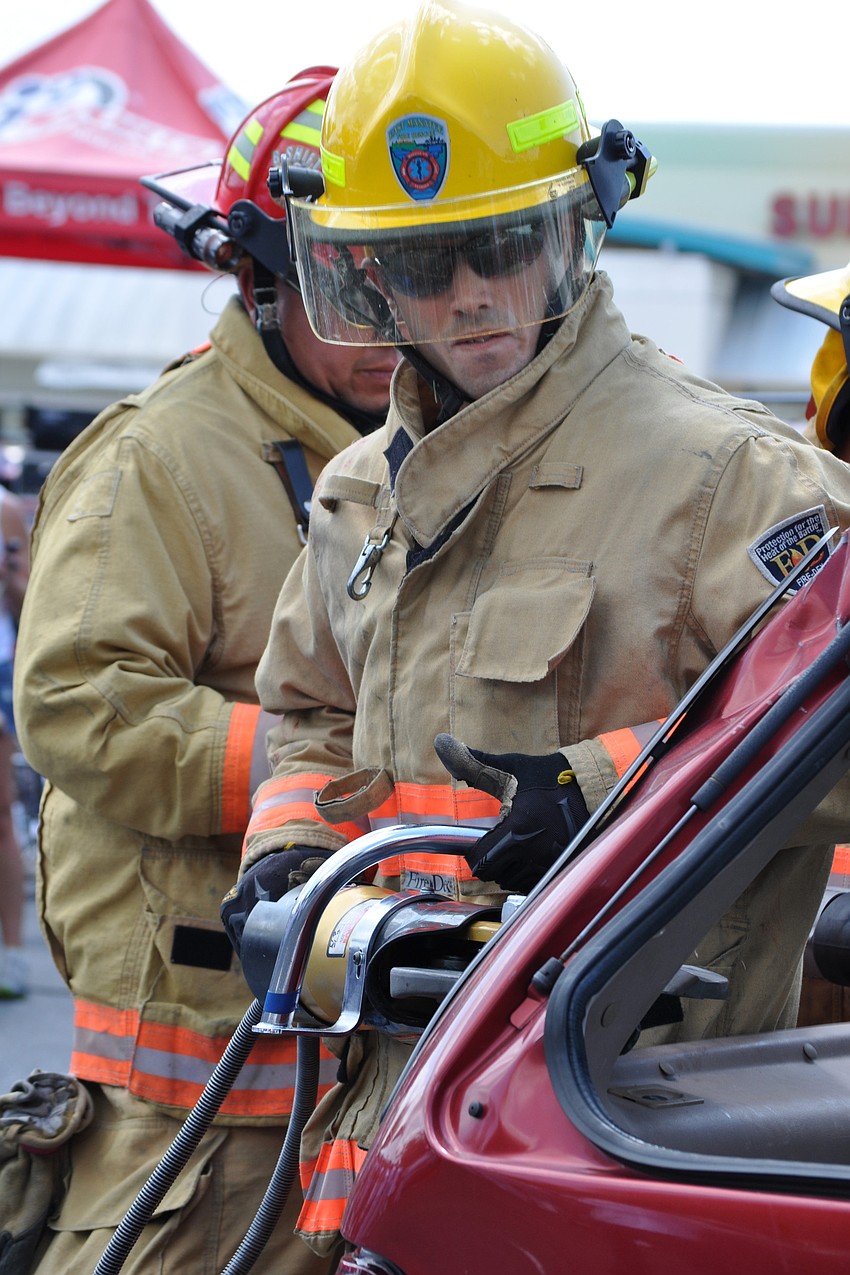 East Manatee Fire Rescue Stephen Krajacic demonstrated how emergency workers use a hurst cutter tool to cut through a vehicleâ€™s frame.