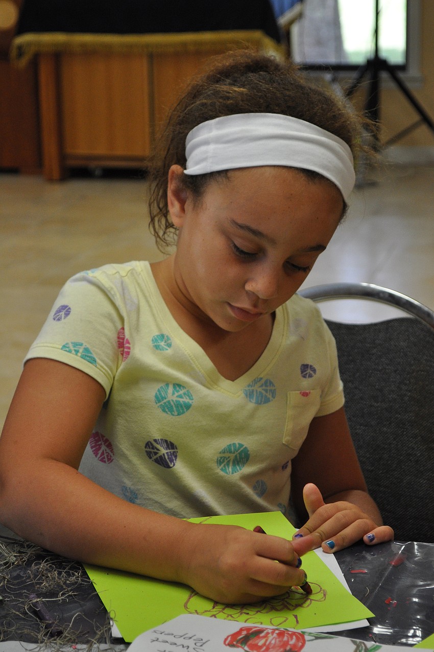 Shoshona Kaufman, 8, drew her favorite flower, a rose.