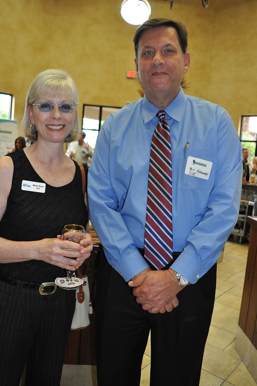 Micki Kann, of Aflac, with Bill Growney, of SOI