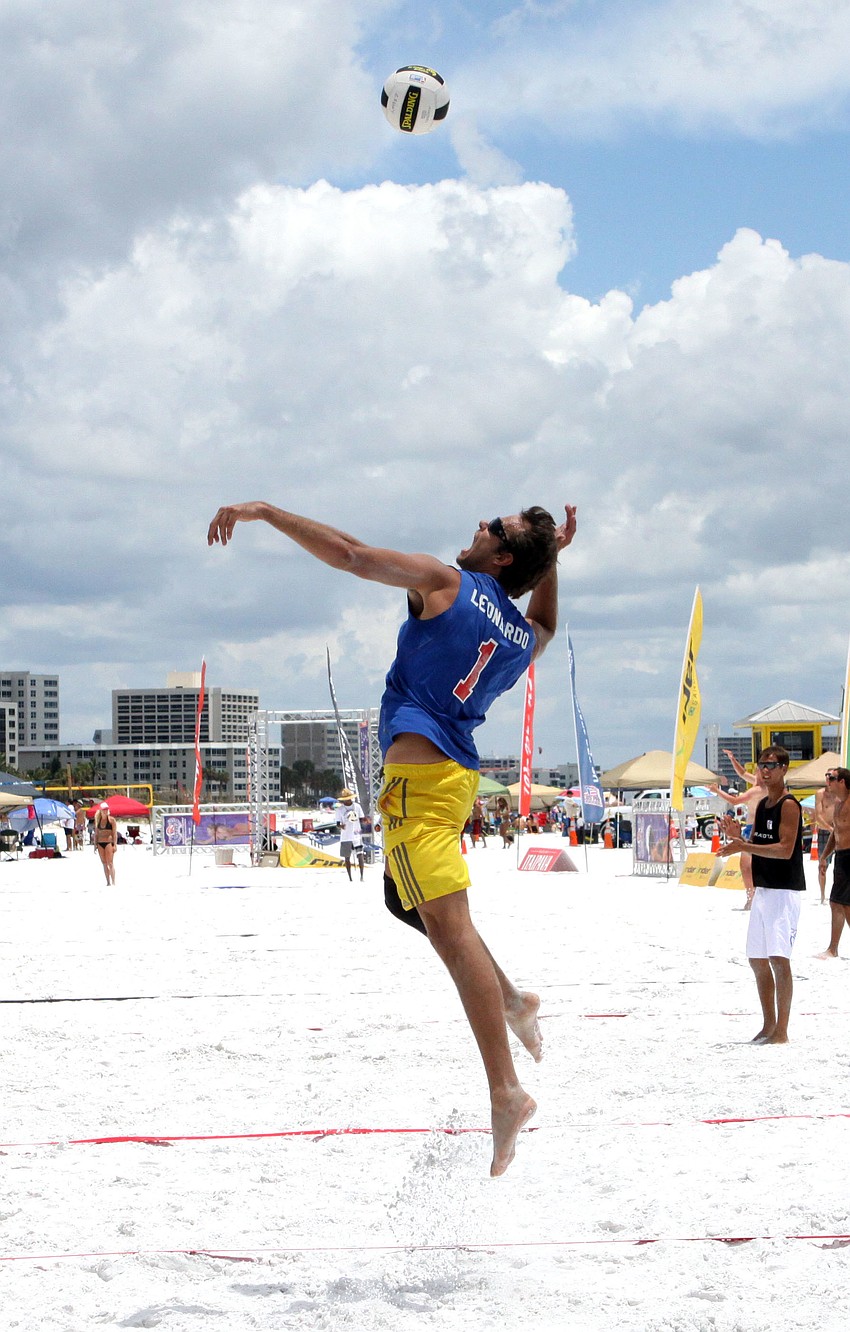 Leonardo Lunardi prepares to hit the ball back over the net during a match against Kent Ammons and Diogo Sousa on Saturday.
