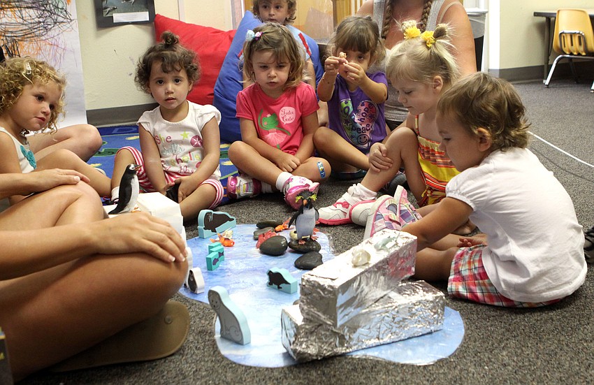 The two-year-old class learns about the habitats of penguins.