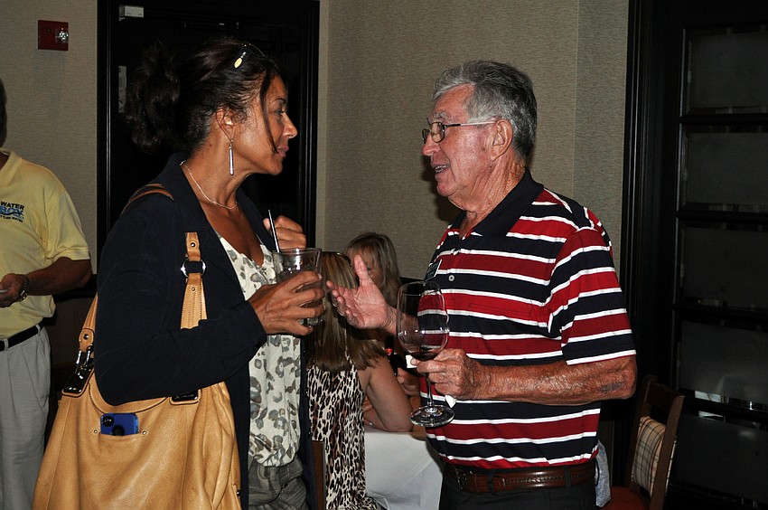 Jeannie Gomes and Vern Johnson chat with one another, Thursday, July 19, at the Siesta Key Chamber of Commerceâ€™s gathering at Ruthâ€™s Chris Steak House.