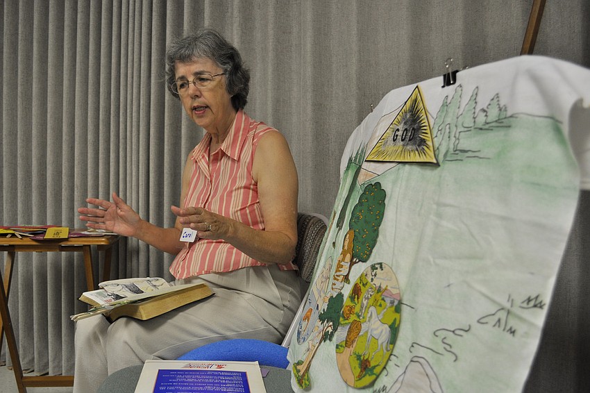 Volunteer Carol LeFebvre told the children stories from the Bible.