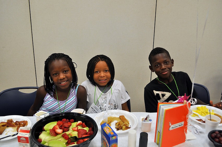 Shmiyah, Miriyah and Eldrian enjoy their breakfasts.