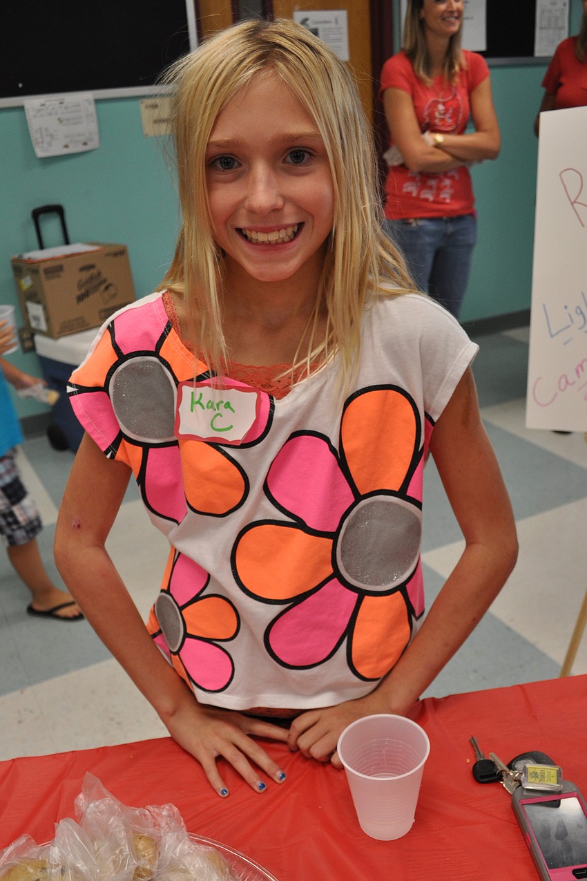 Braden River Middle School student and Tara graduate Kara Claussen, 11, helped pass out cookies.